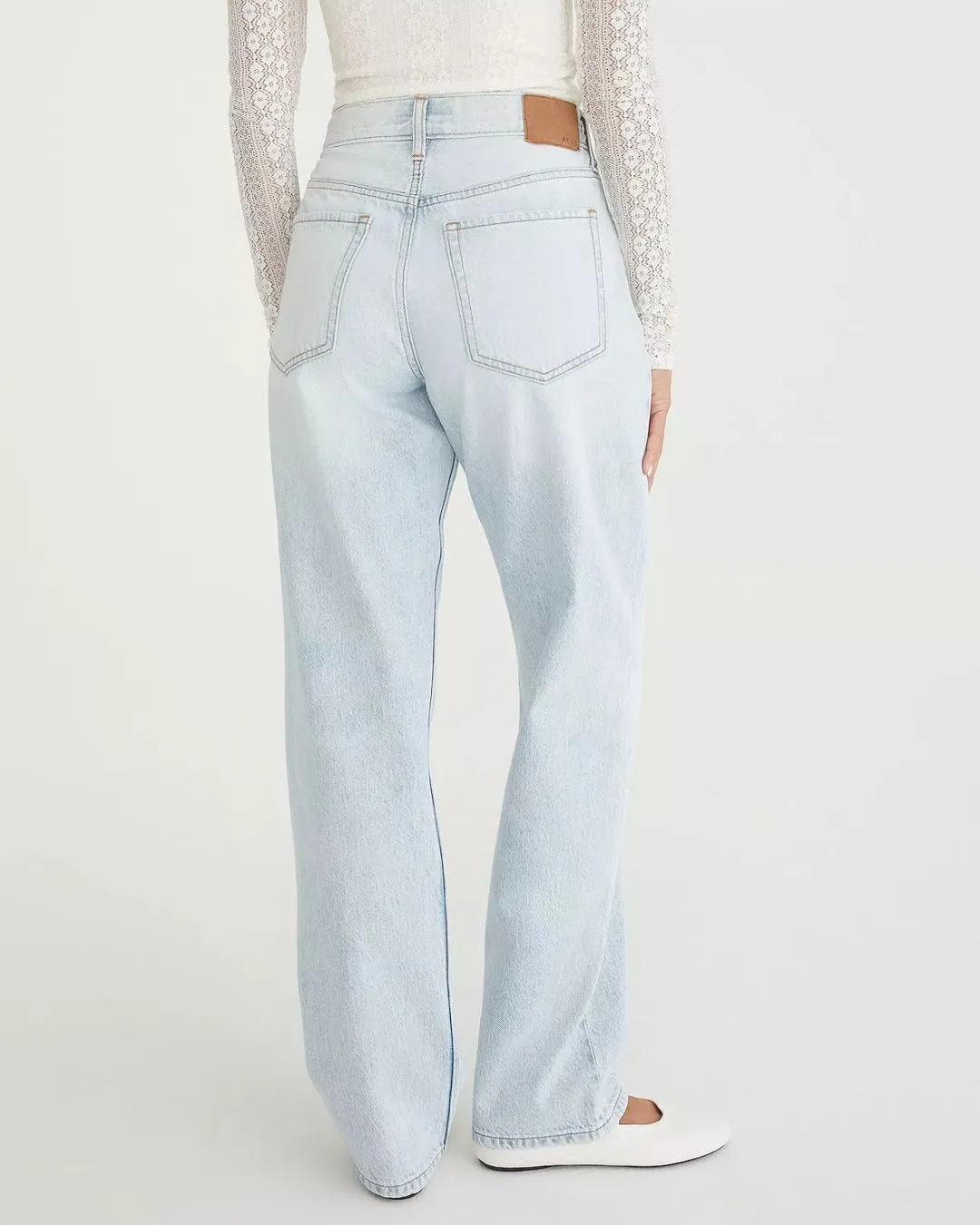 Light wash super high rise baggy jeans inspired by nineties style. Relaxed straight legs create comfort and confident casual fashion for everyday wear.