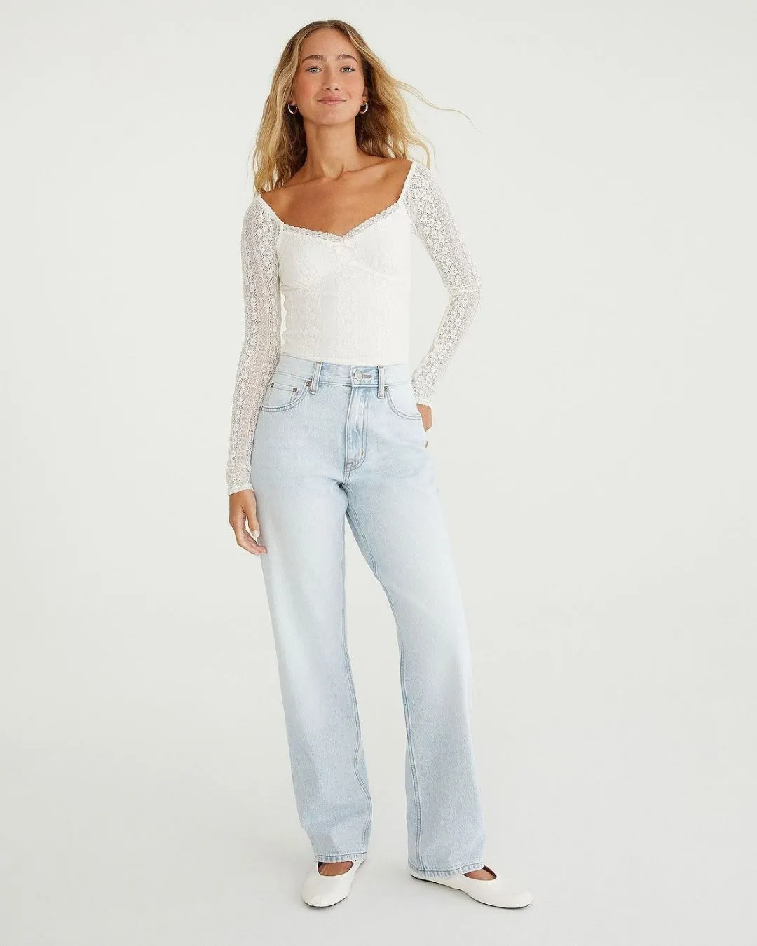Light wash super high rise baggy jeans inspired by nineties style. Relaxed straight legs create comfort and confident casual fashion for everyday wear.