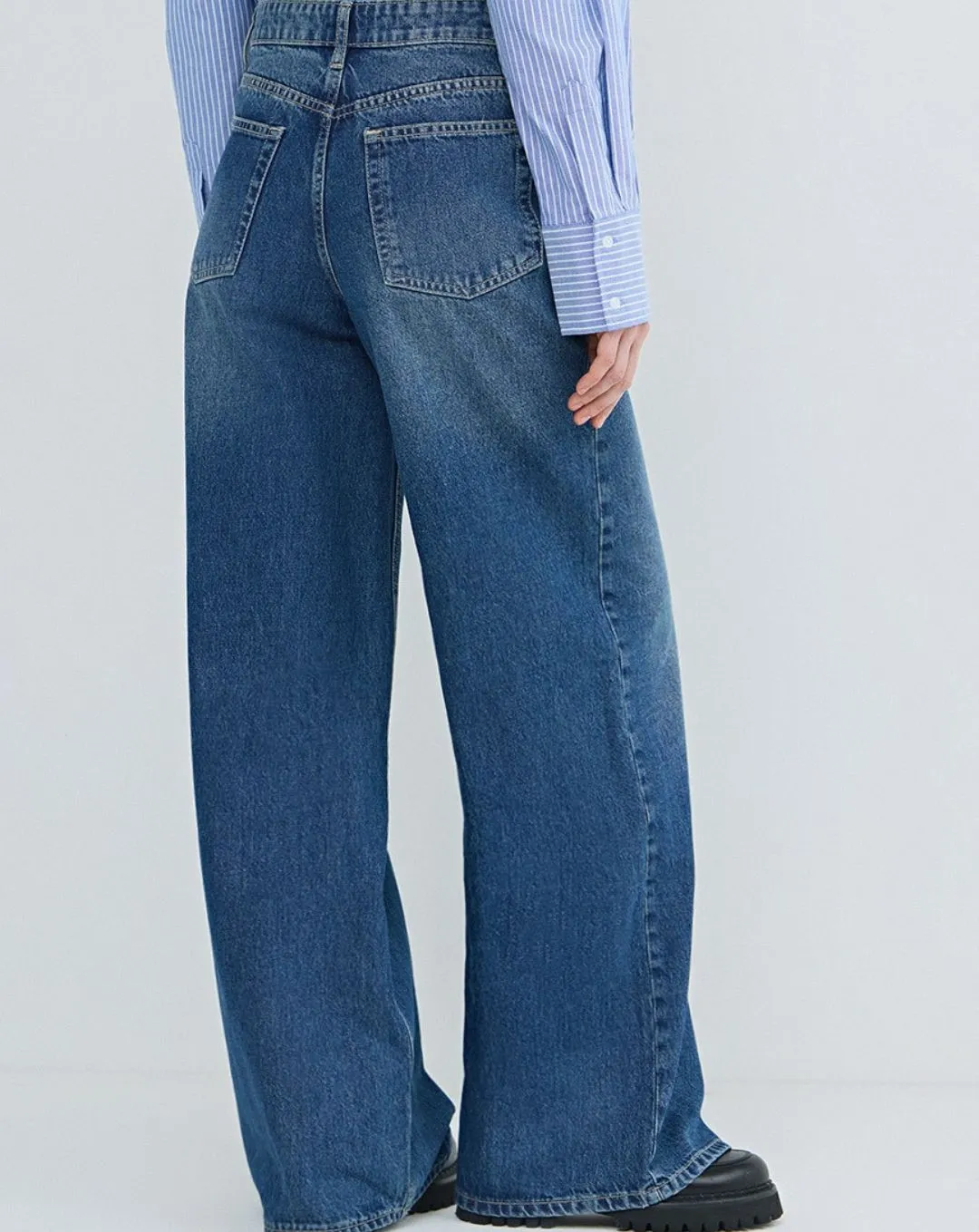 Bold volume meets timeless style with the Woman Ostin Super Wide Leg Denim in dark blue. Designed with a flattering high rise and flowing wide leg fit for confident everyday wear.