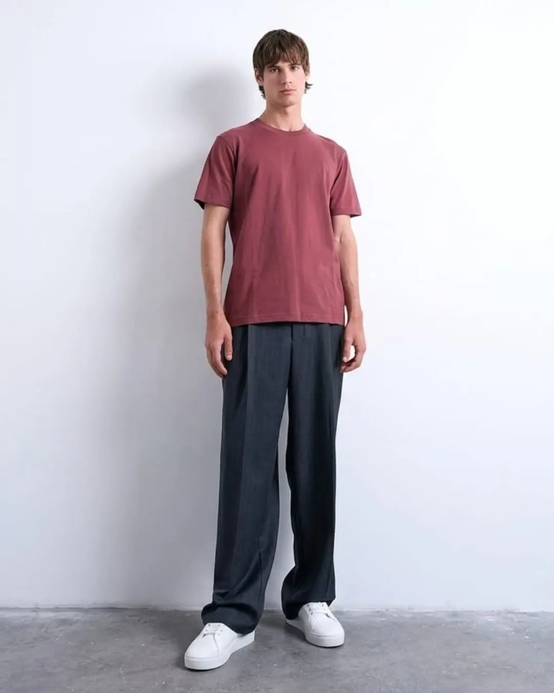 Modern mens burgundy red tee with clean crew neck style and soft comfort. Easy everyday wear that pairs with trousers or denim for relaxed confident fashion.