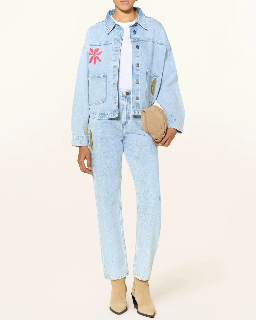 A stylish light wash Ichi denim set with a relaxed fit and artistic details perfect for creating a modern and effortless everyday look.