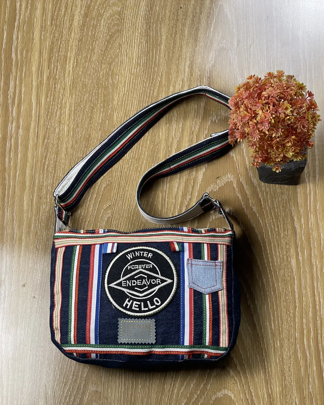 A bold denim crossbody crafted from reclaimed jeans designed for everyday style and conscious fashion lovers.