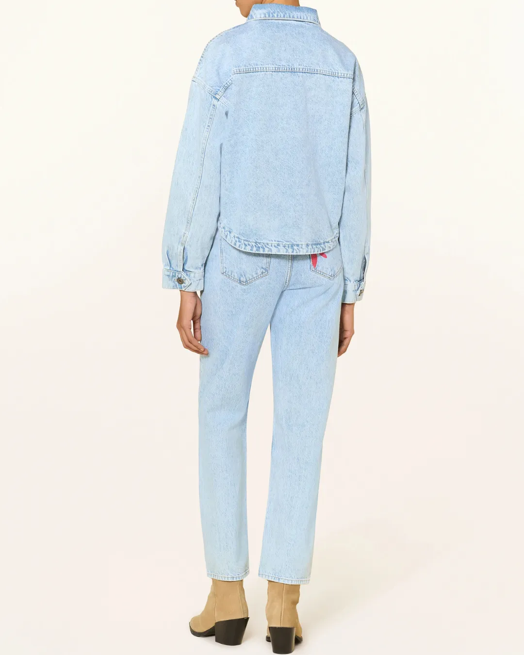 A stylish light wash Ichi denim set with a relaxed fit and artistic details perfect for creating a modern and effortless everyday look.